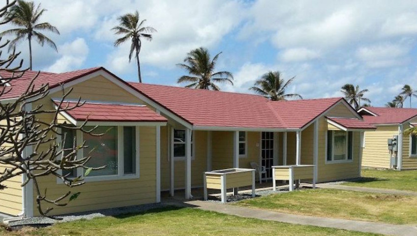 Cream colored houses with red slanting roof