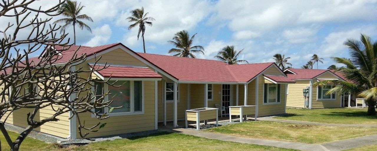 Cream colored houses with red slanting roof