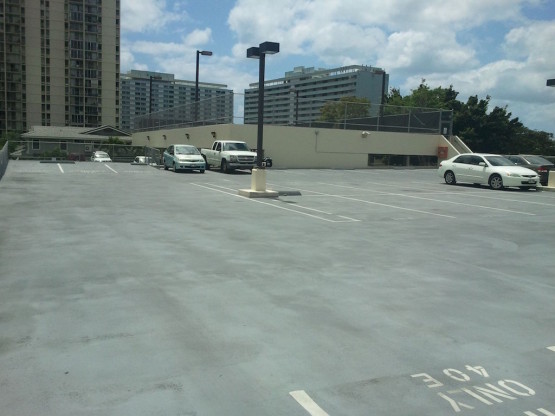 Cars parked on the roof parking of a building