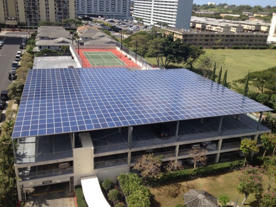 A building with blue colored solar roof