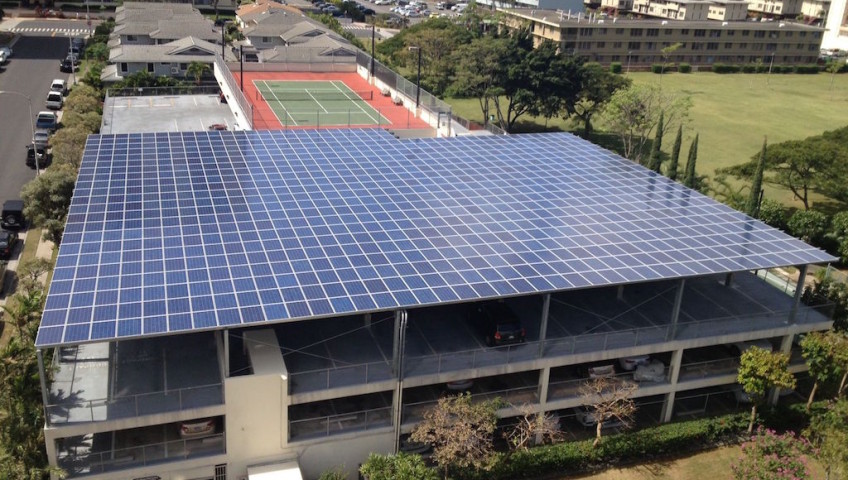 A building with blue colored solar roof