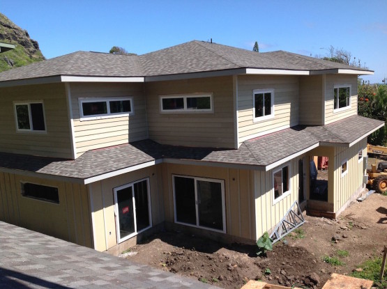 Cream colored house with grey roofs