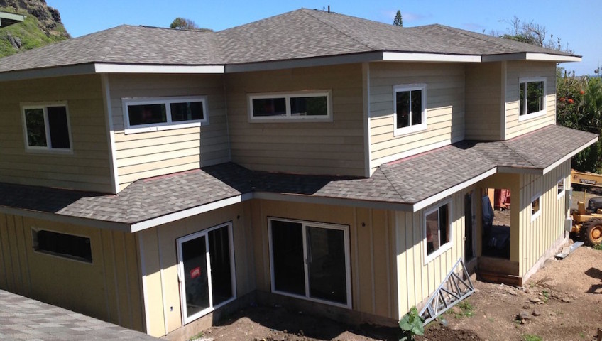 Cream colored house with grey roofs