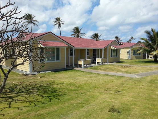 Brown colored house with red roof