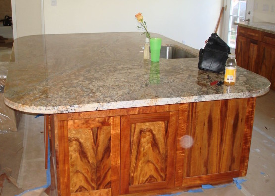 Brown colored Wooden cabinets with a basin