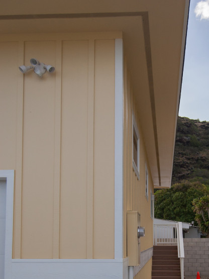 Corner of a cream colored house in white