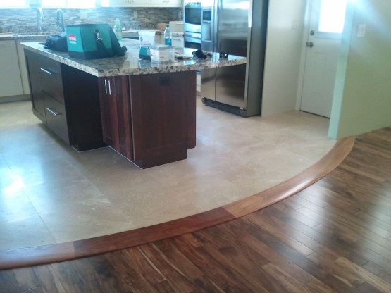 A dining table in front of the fridge