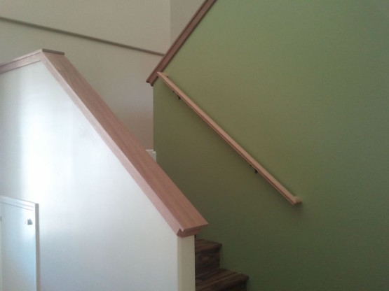 Brown colored stairs with cream colored railings
