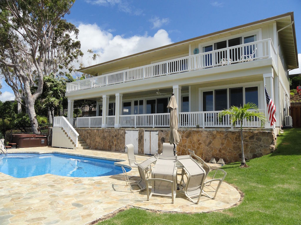 A table and chairs near the swimming pool