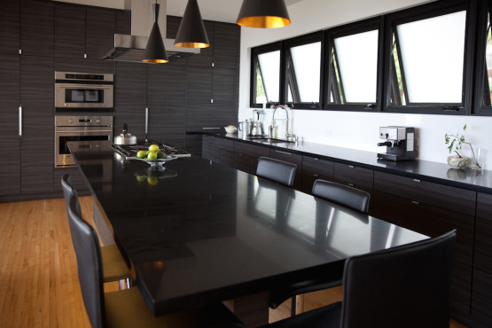 A black colored dining table with a stove