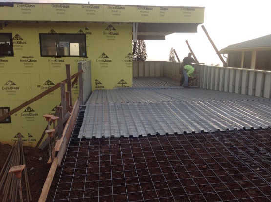 A yellow colored house under construction