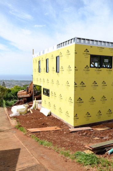 A digital image of a yellow colored house