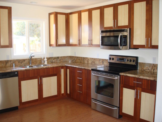 Wooden cabinets and a steel plated stove