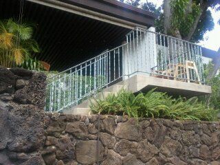 Green colored railings covering the stairs