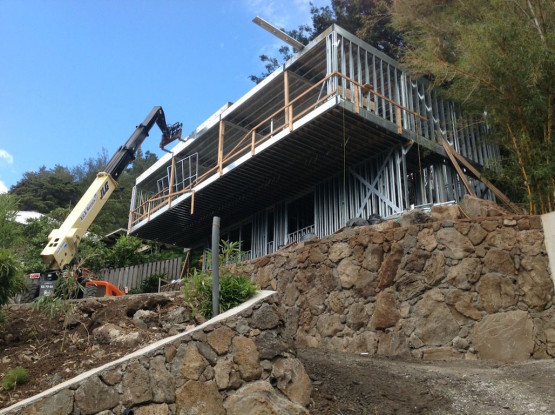 A heavy machinery near an under construction house