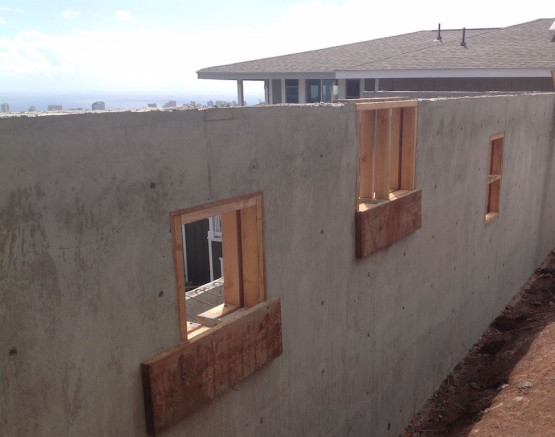 A under construction wall of a house with windows