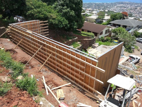 Heavy machinery near a under construction house