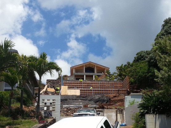 An under construction building by the hillside