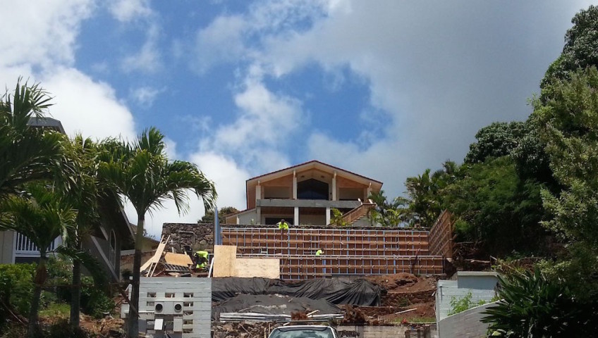 An under construction building by the hillside