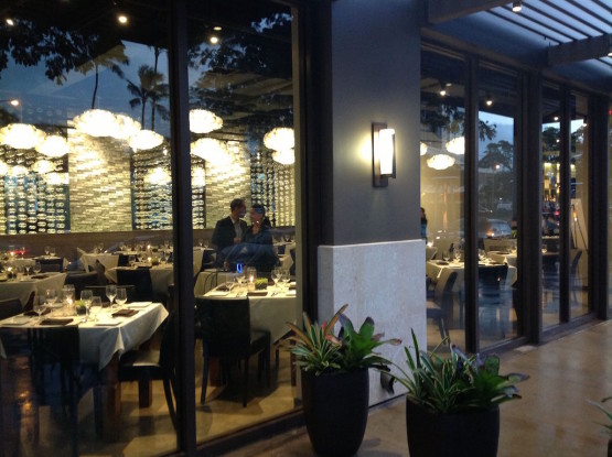 Tables and chairs inside a lavish hotel