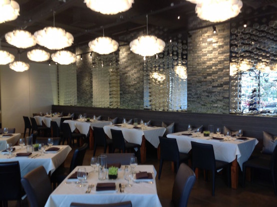 Tables and chairs inside a lavish hotel