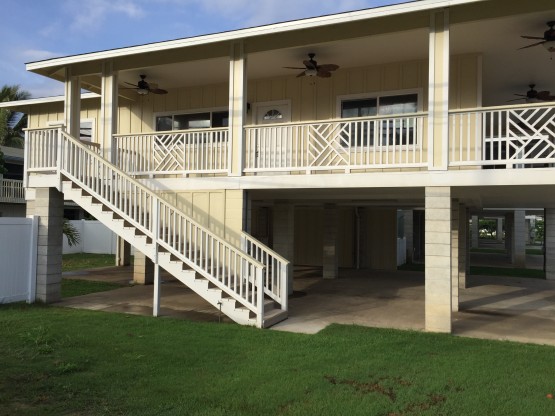 White colored stair case leading to a house